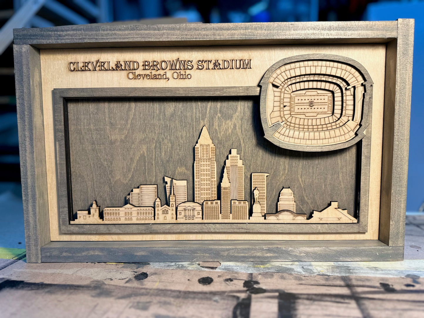 Laser Engraved layered stadium with City skyline.