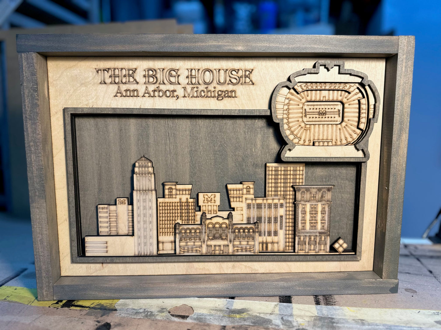 Laser Engraved layered stadium with City skyline.