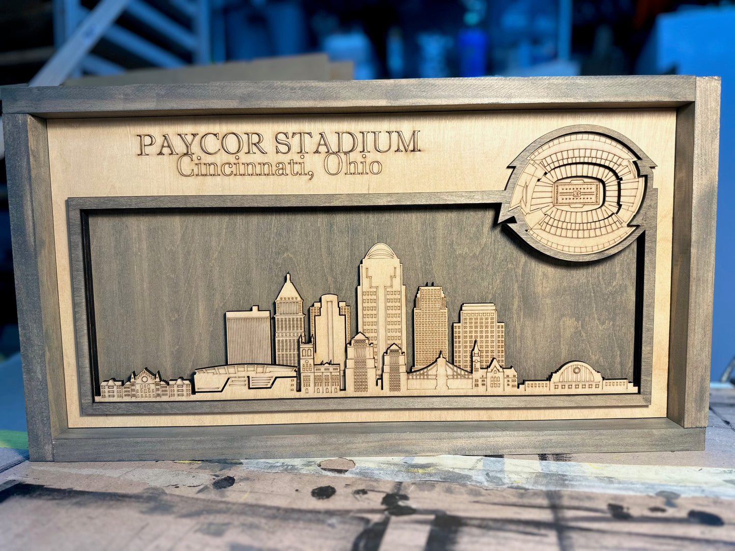 Laser Engraved layered stadium with City skyline.