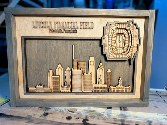 Laser Engraved layered stadium with City skyline.